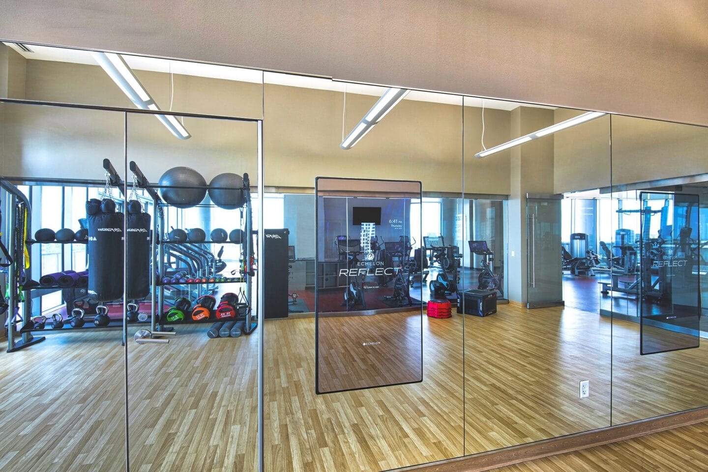 Fitness Center with Echelon Reflect smart mirrors at The Sovereign at Regent Square, 3233 West Dallas, TX