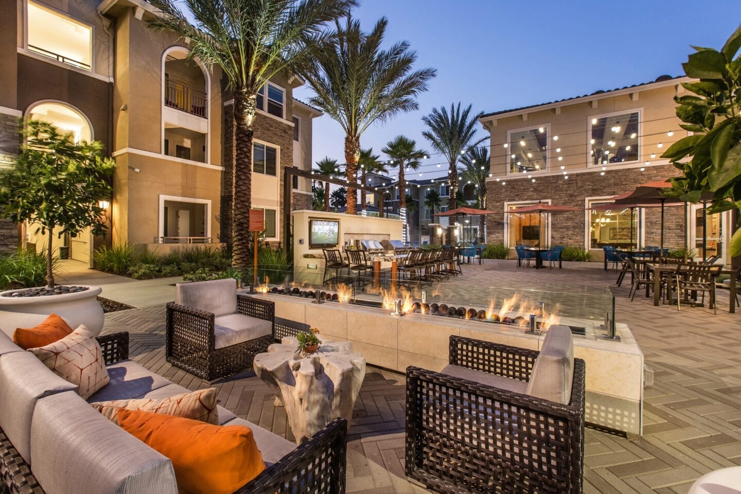 Outdoor Living Area With Fireplace at Valentia by Windsor, La Habra, 90631