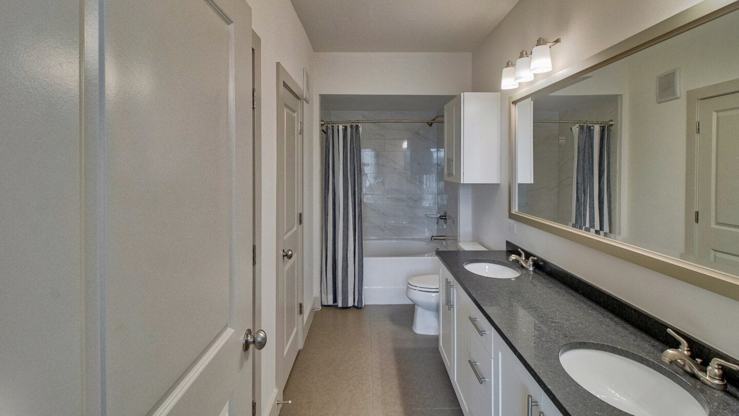 Dual Vanities with Contemporary Lighting at Windsor Oak Hill, 6701 Rialto Blvd, Austin