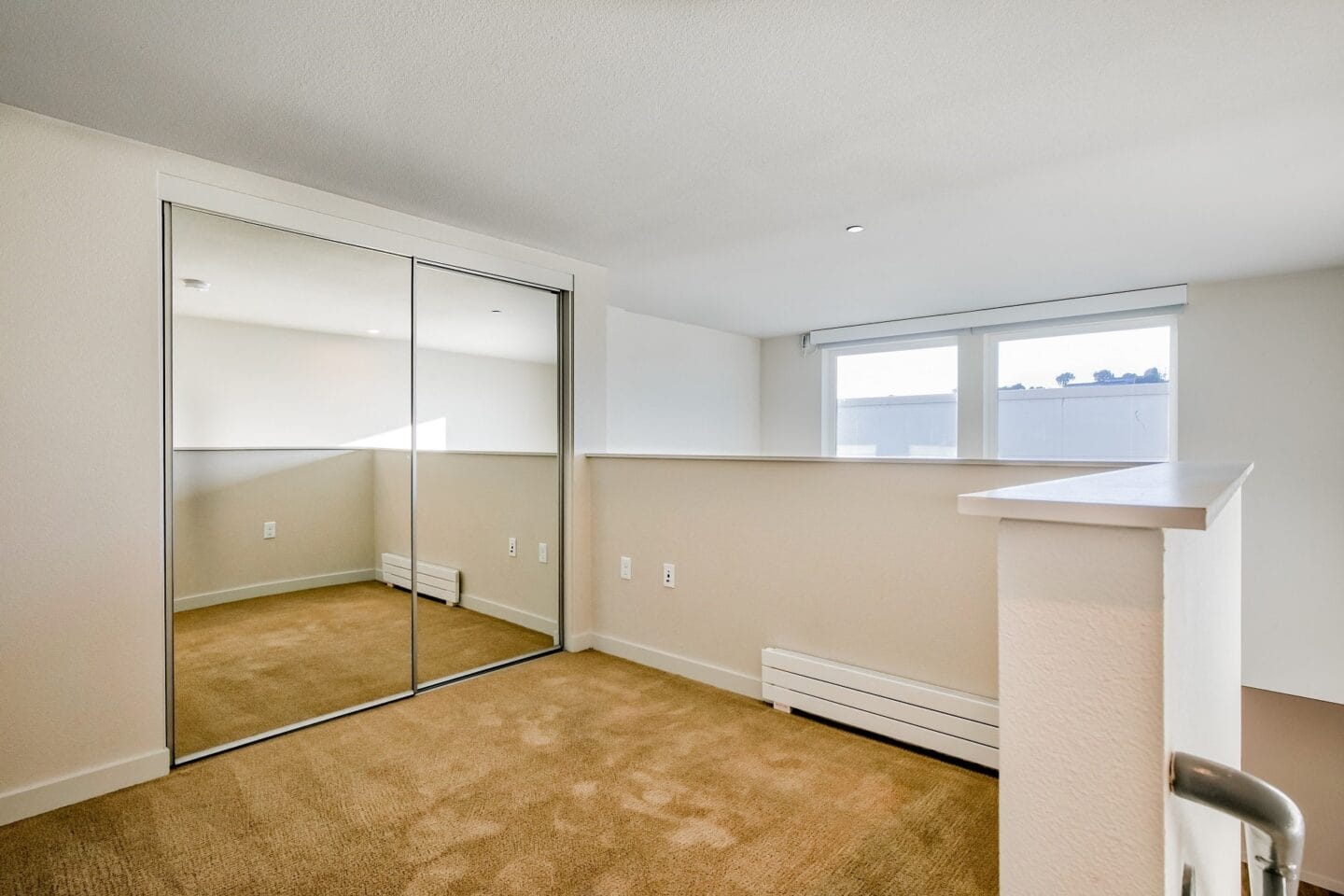 Mirrored closets in bedroom at Dogpatch, San Francisco