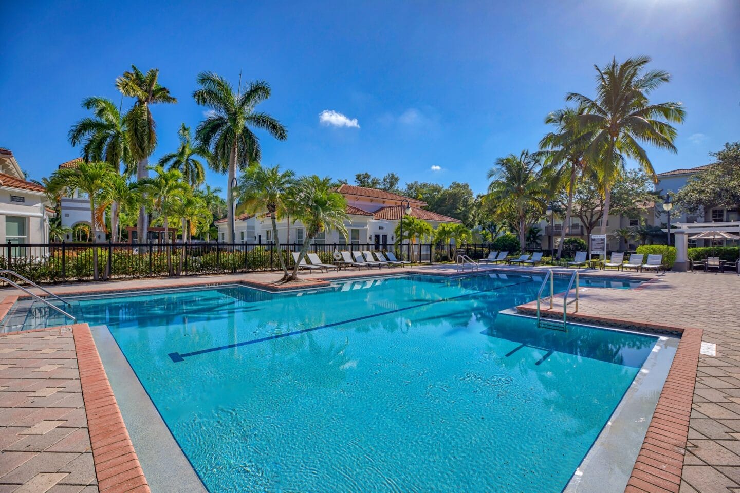 Large resort style pool with lots of landscaping