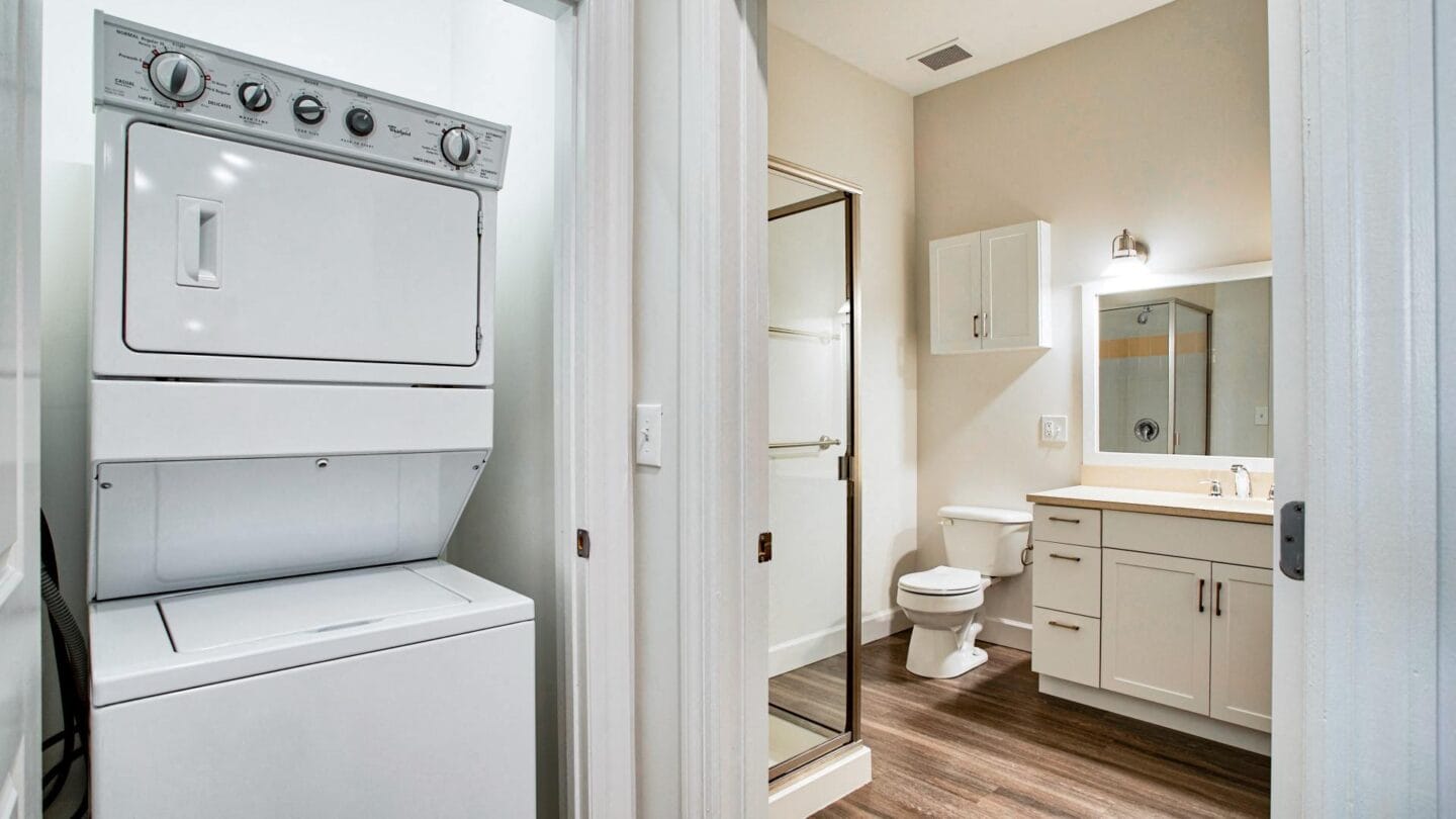 a bathroom with a washer and dryer