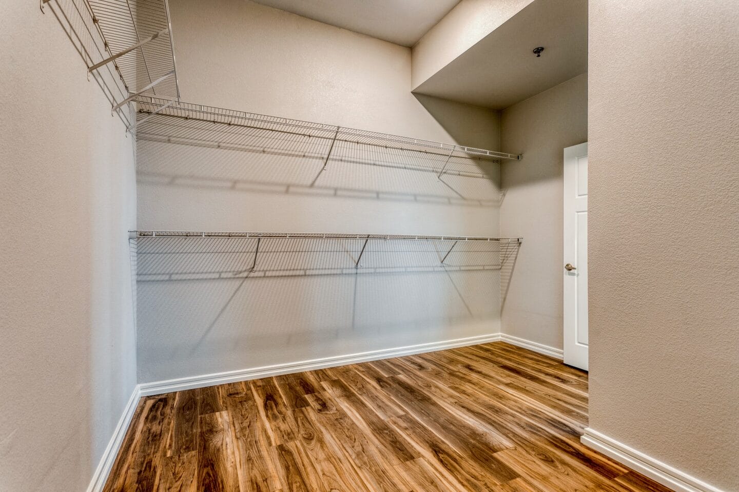 Large walk-in closets with shelving in select bedrooms