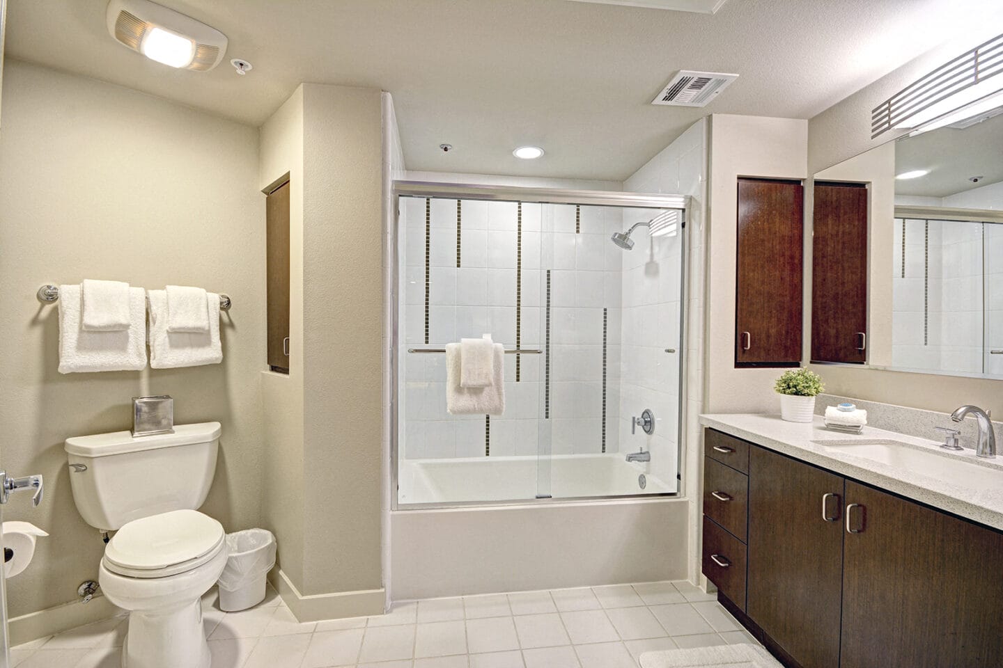 Modern bathrooms with ceramic tile and oversized tubs at 5550 Wilshire at Miracle Mile by Windsor, CA 90036