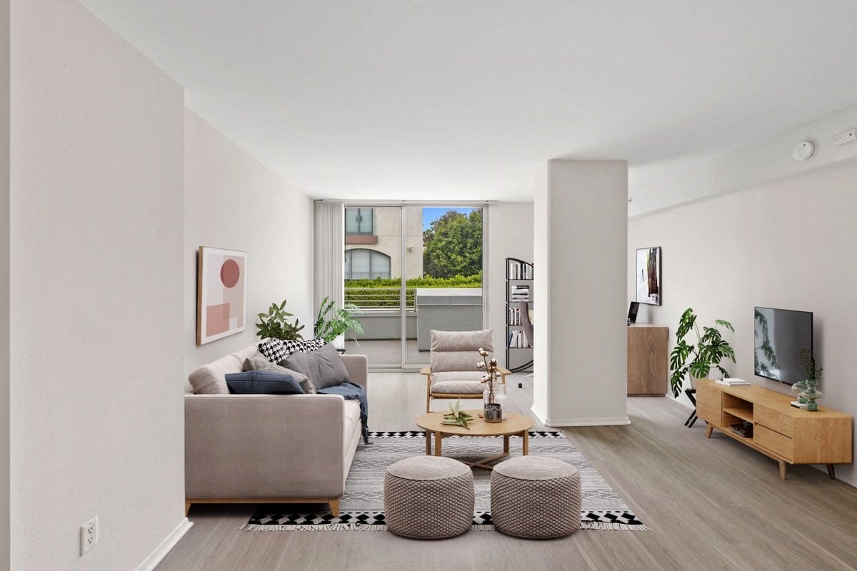 a living room with two couches a coffee table and a tv