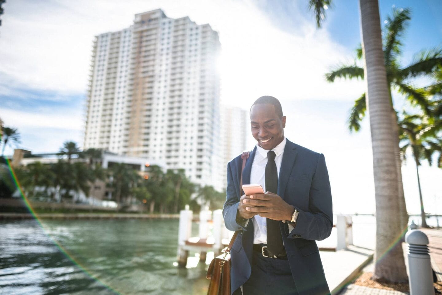 Man on phone near water at Windsor 335, Plantation, FL