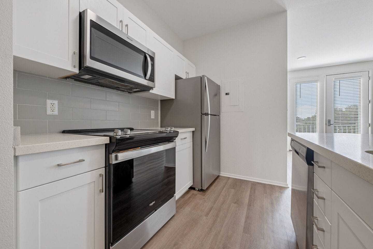 Open kitchen layout with stainless steel appliances at Terraces at Paseo Colorado, California, 91101