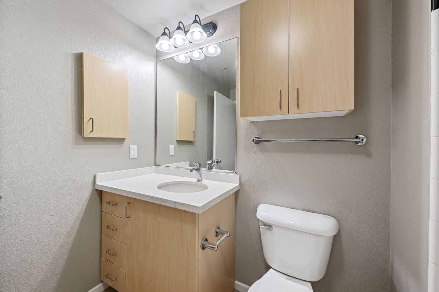 Bathroom with wood like cabinets at Terraces at Paseo Colorado, California, 91101