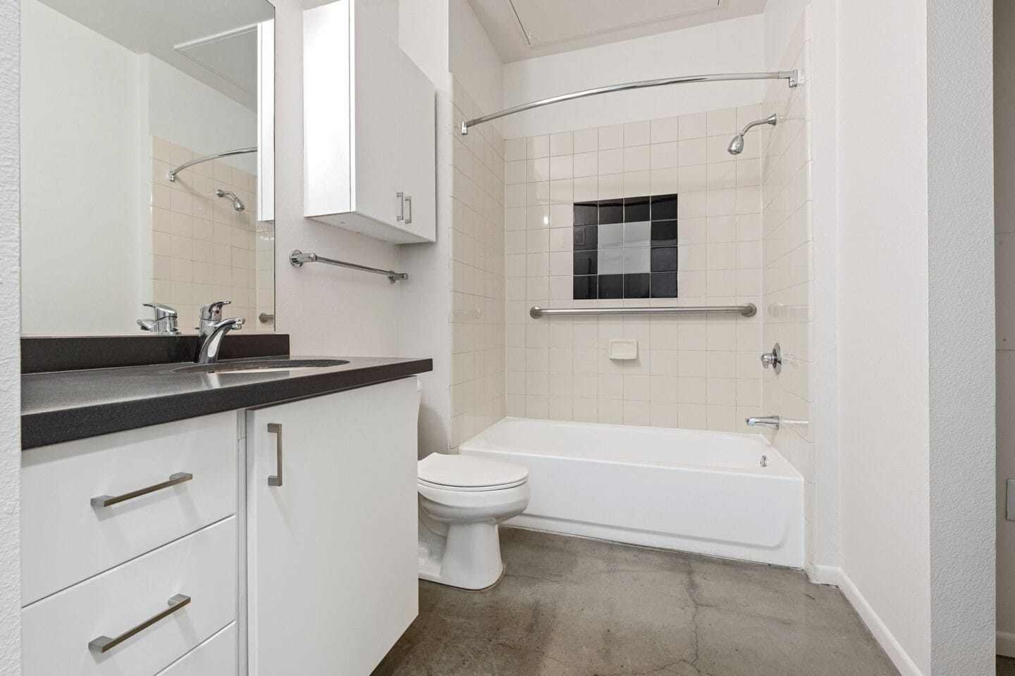 A bathroom with a toilet and a tub and a sink at Terraces at Paseo Colorado, California, 91101