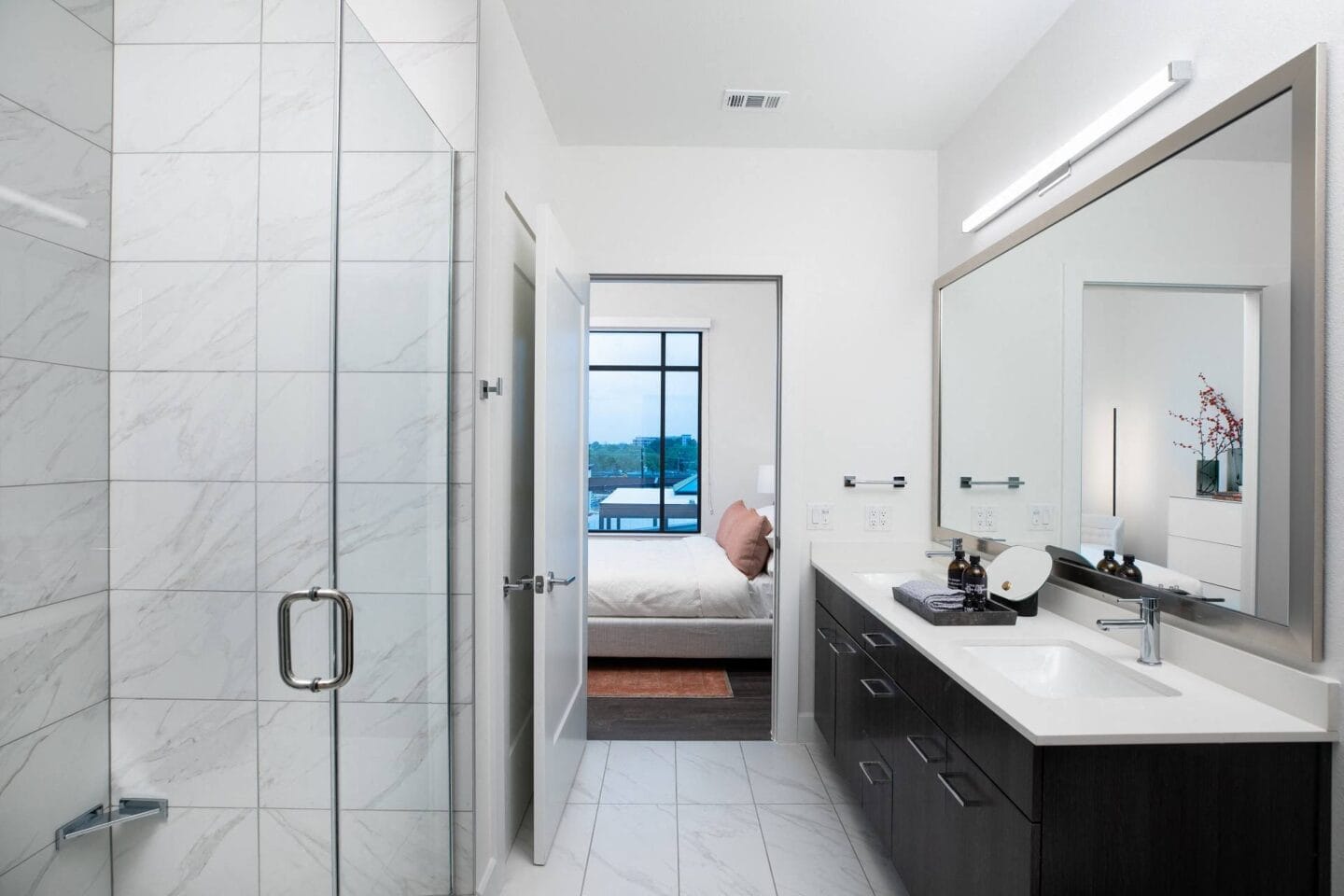 A  bathroom with a sink and a mirror  at The Sterling at Regent Square, Houston, TX