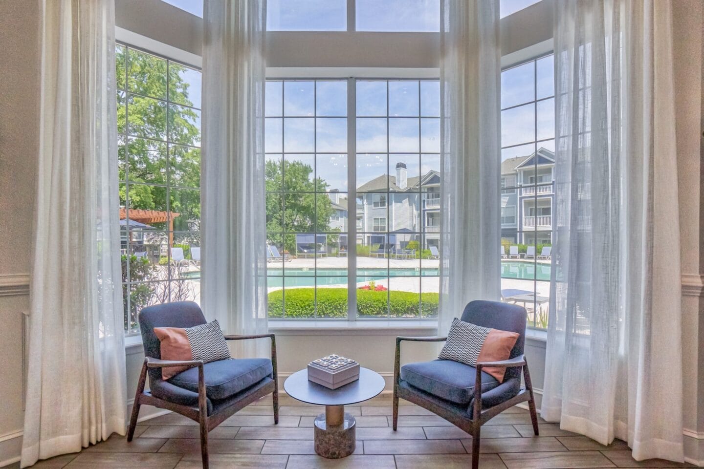 Clubroom with pool view at Windsor Addison Park