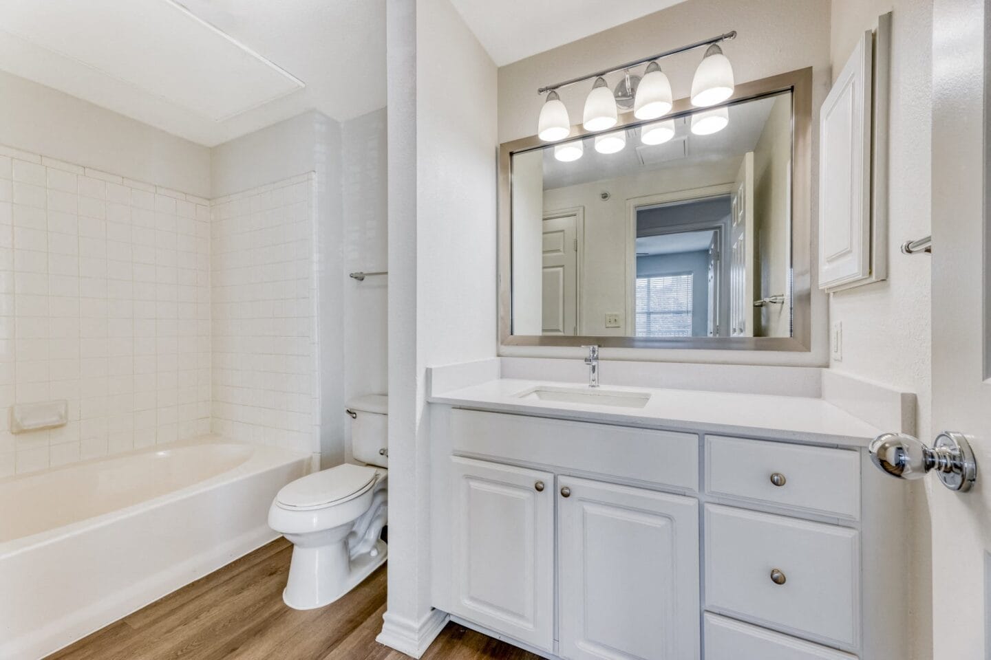 A bathroom with a toilet sink and bathtub    at Windsor Westbridge, Carrollton, TX