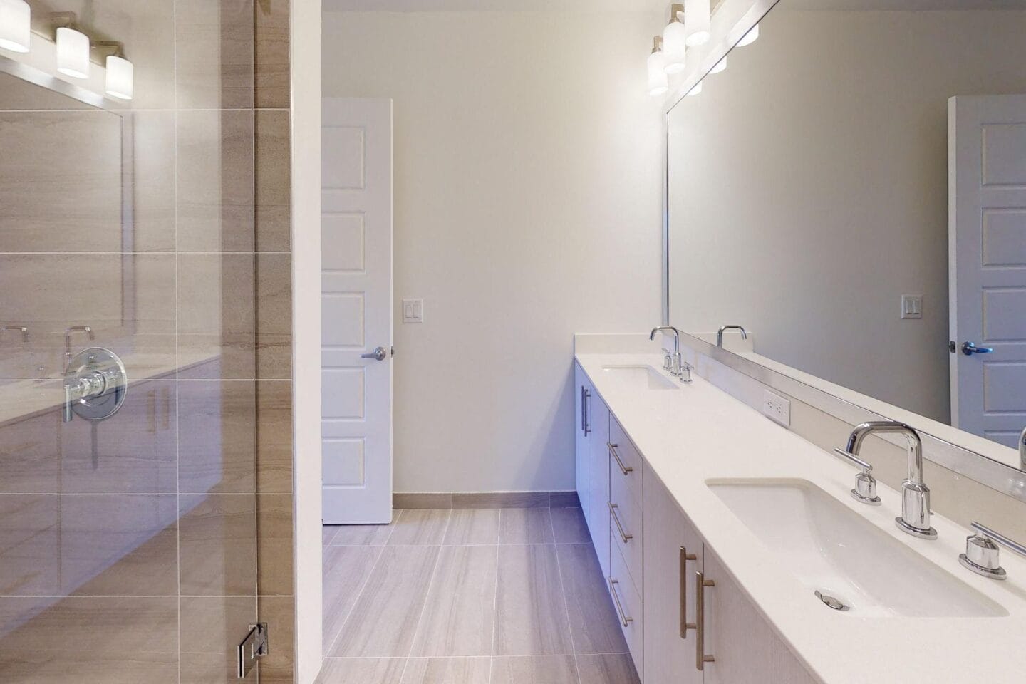 Spacious in suite master bath with custom-framed mirror at Windsor Cornerstone, Florida