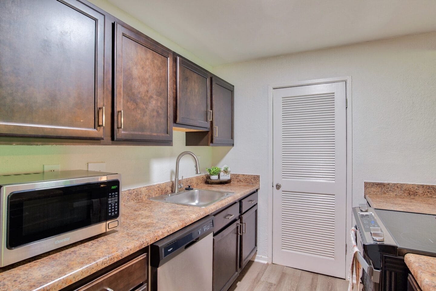 Kitchen with a sink and a microwave at Windsor Peachtree Corners, Peachtree Corners, GA