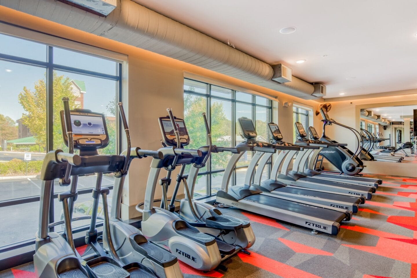 Fitness center featuring cardio equipment