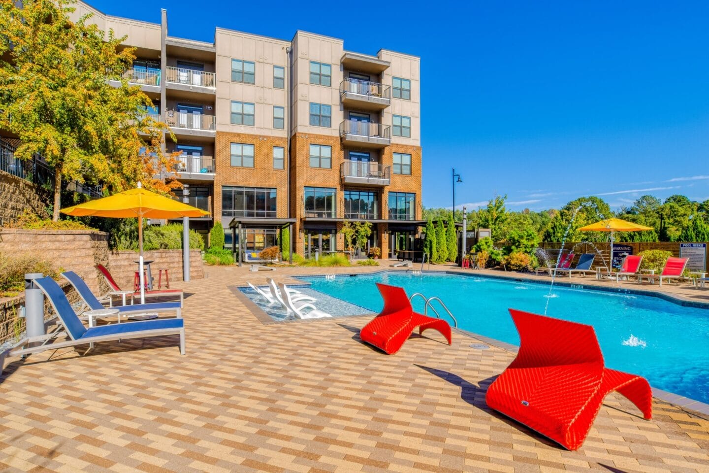 Pool Side Relaxing Area With Sundeck at Stadium Walk By Windsor, Georgia