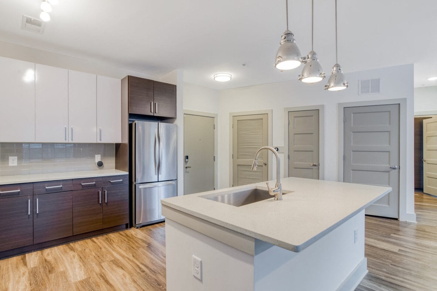 Quartz countertops, stainless steel appliances and elegantly finished kitchen