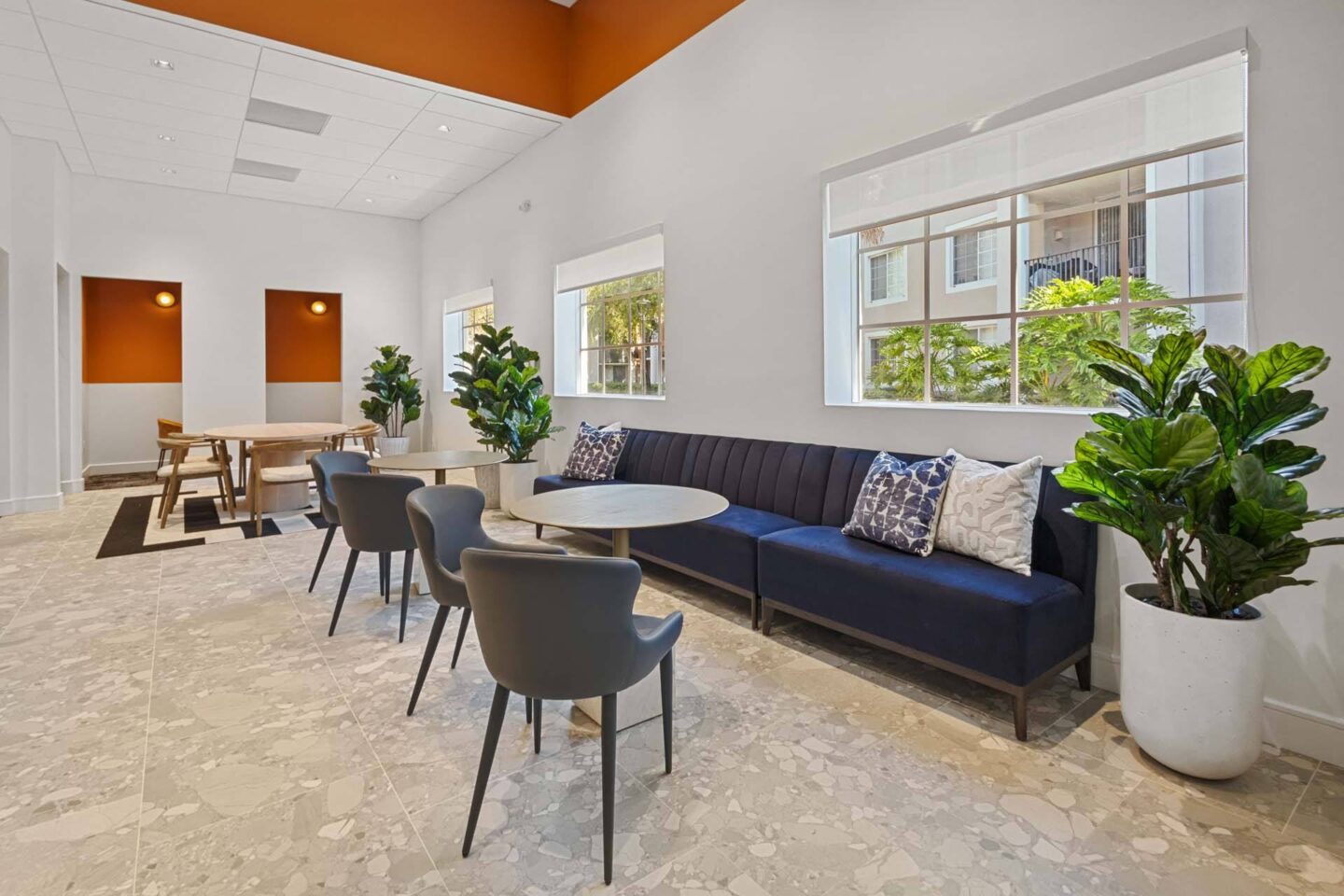 A lounge with a large couch and a coffee table at Windsor Coconut Creek, Coconut Creek, 33073.