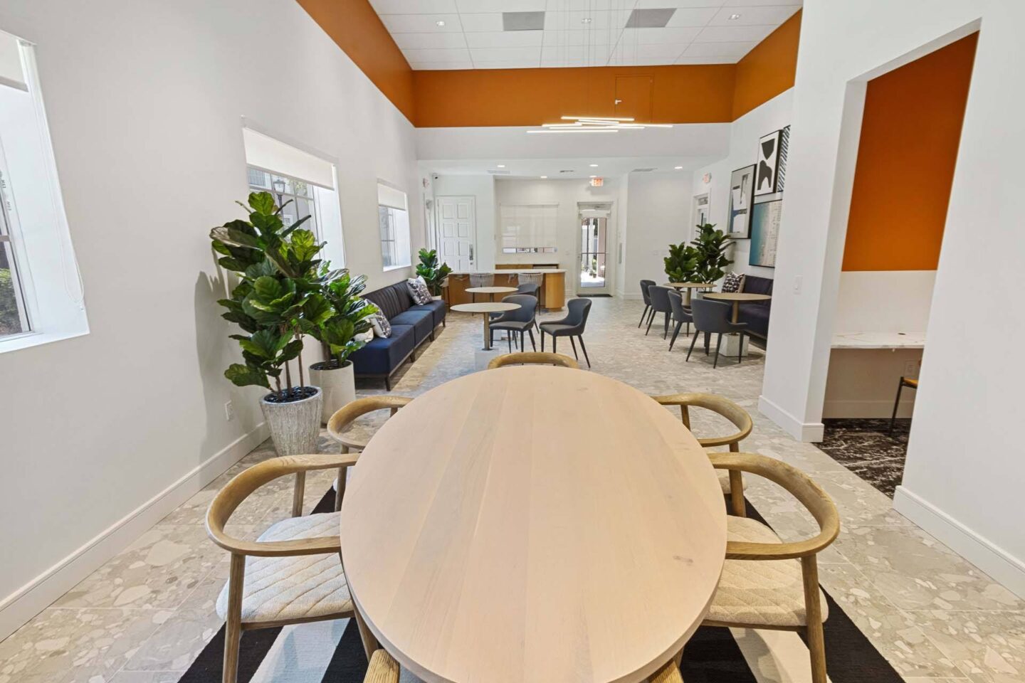 A conference room with a large table and chairs.