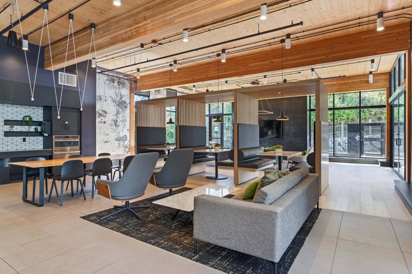 A modern lounge with a wooden ceiling and grey furniture at Windsor Totem Lake, 11723 NE 117th Ct, Kirkland, WA 98034.