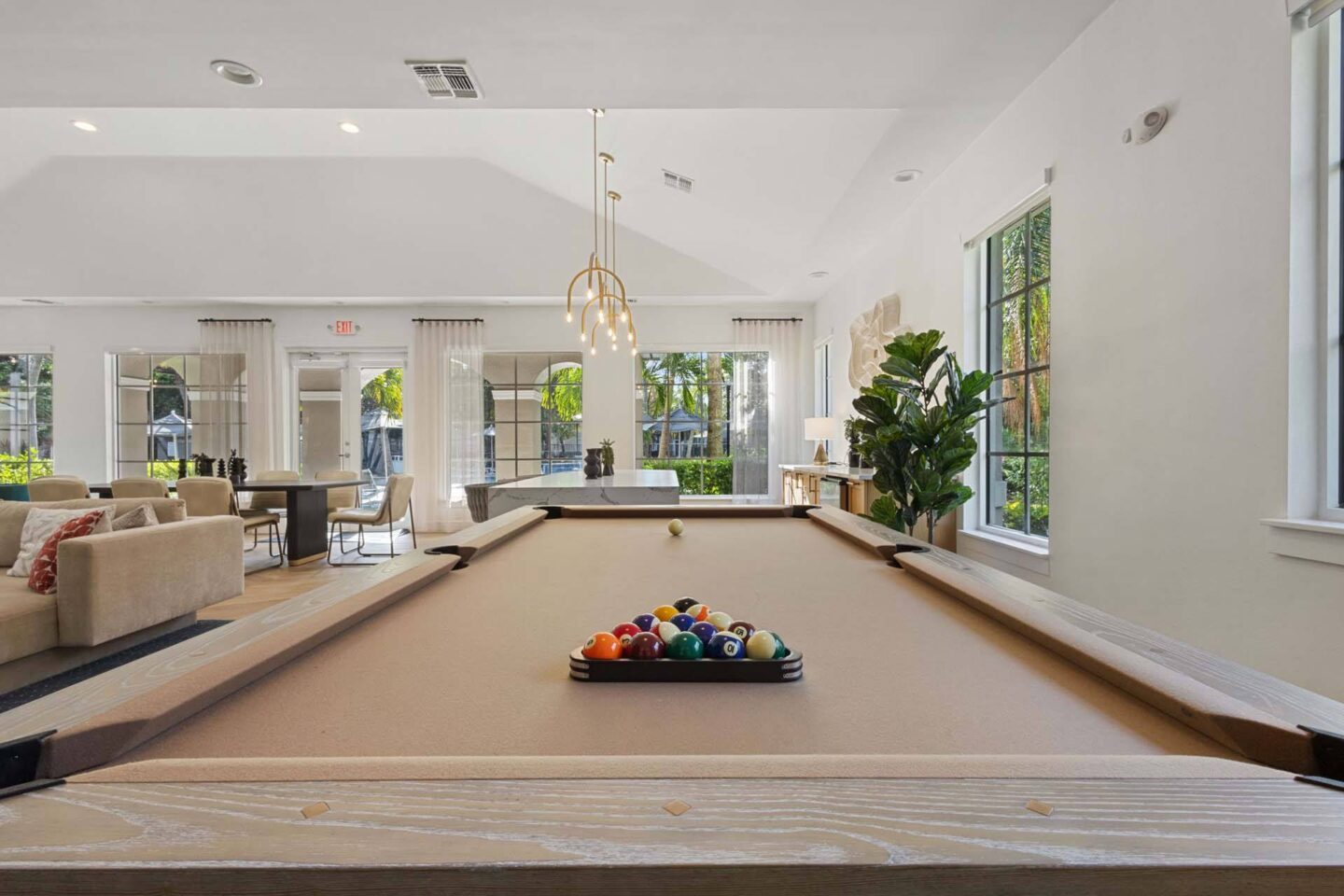 A pool table with a tray of balls on it.