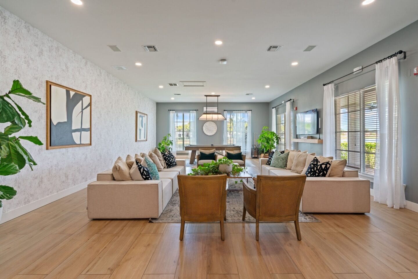 a living room with couches and chairs and a table