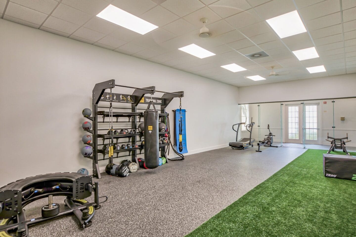 Private work out area with a variety of exercise equipment