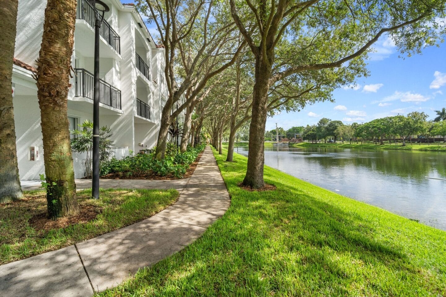 Great landscaping, paths, and onsite lake at Windsor Coral Springs, Coral Springs, FL