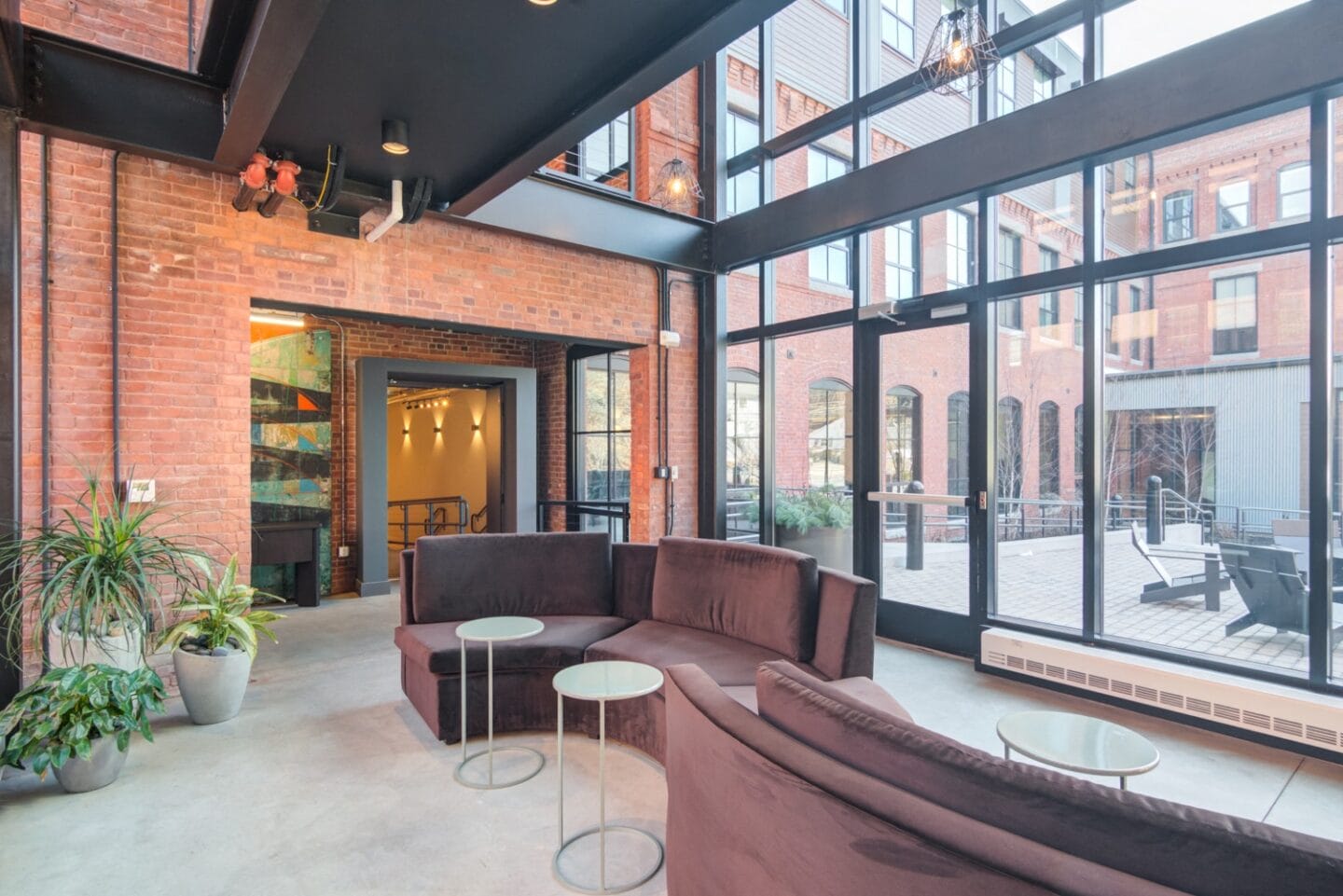 Lobby area with floor to ceiling windows at Windsor Radio Factory