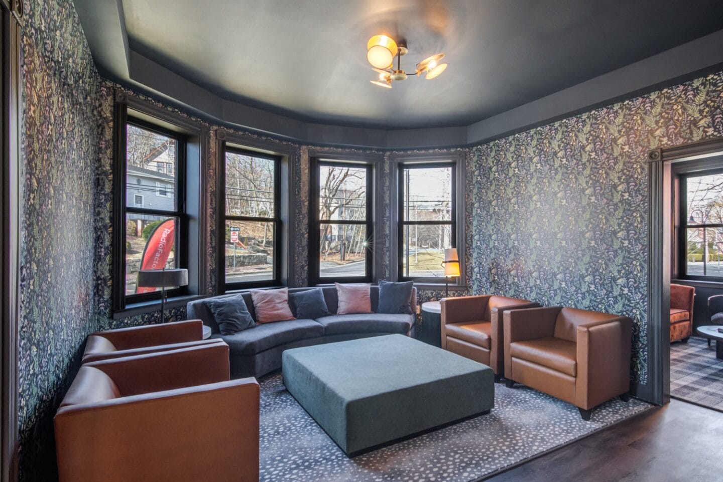 Lounge area with couches and windows at Windsor Radio Factory, Melrose, MA