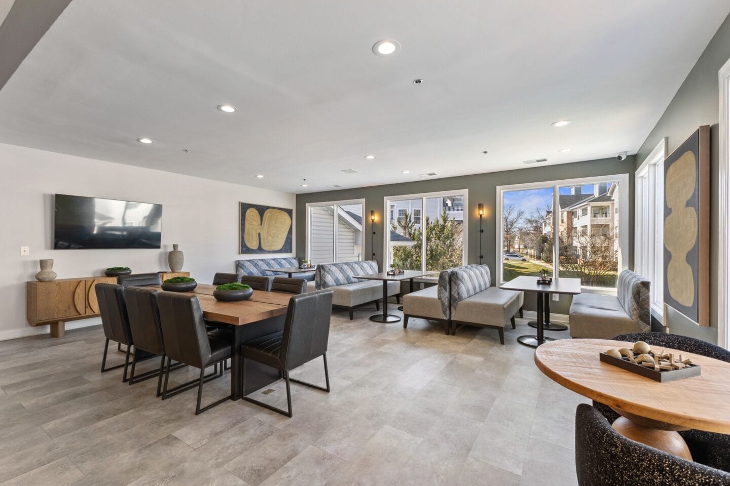 a living room with a table and chairs and a tv