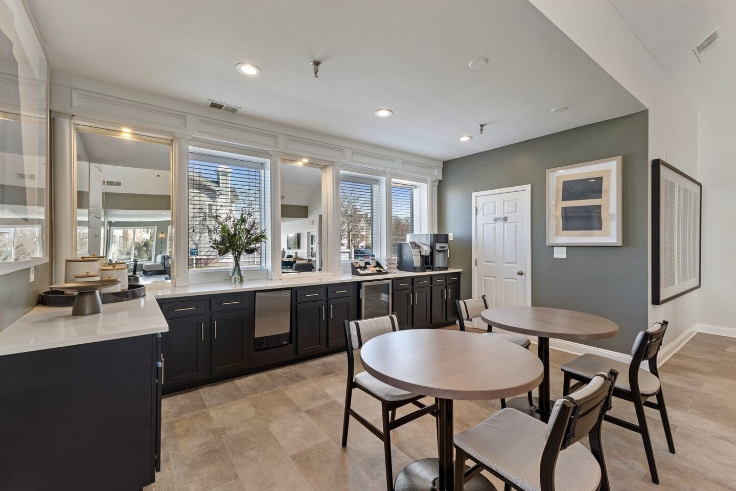 a kitchen and dining area with a table and chairs