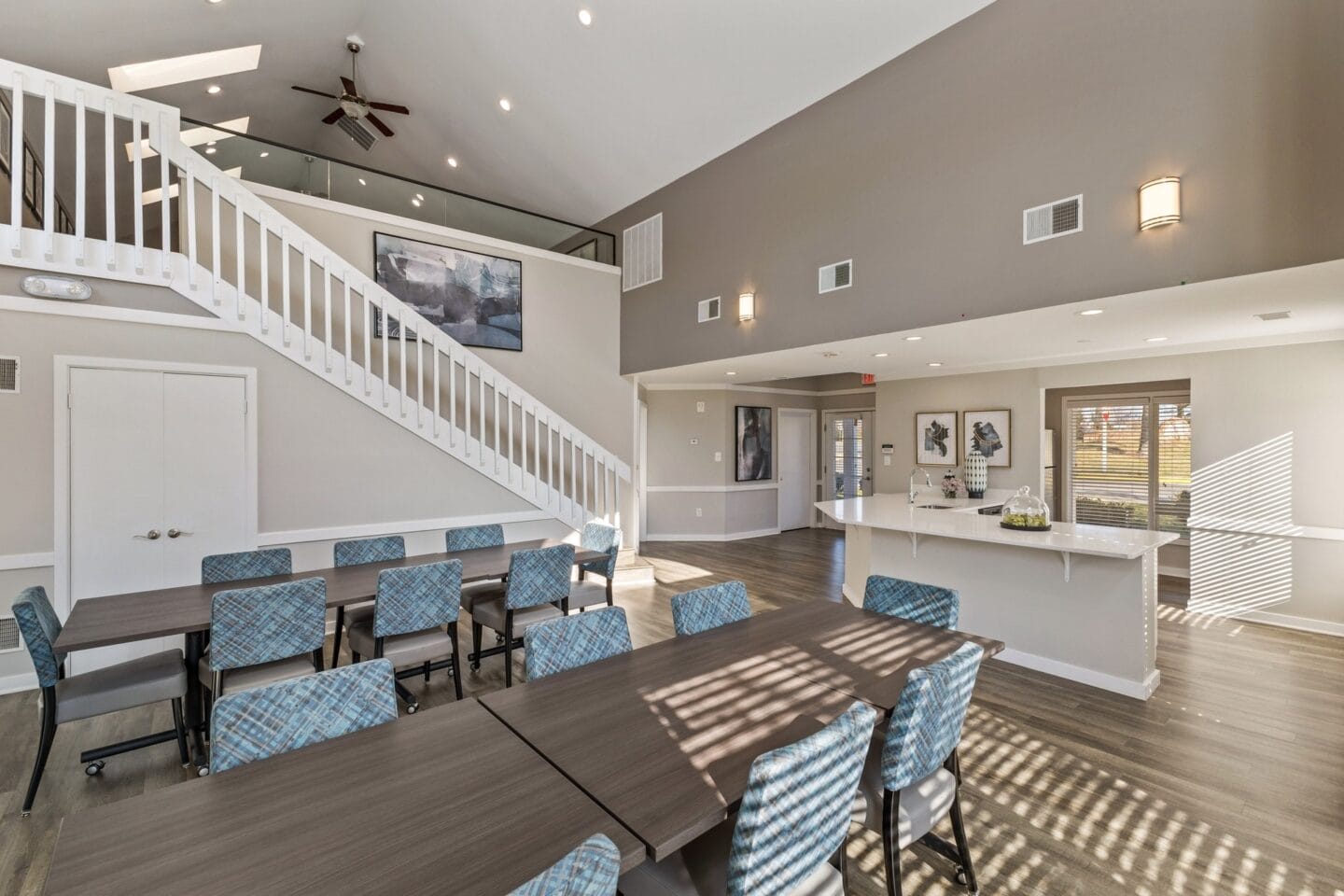 a large dining room with a long table and chairs