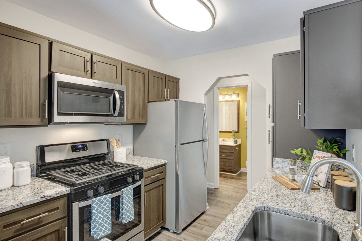 Kitchen with granite countertops and stainless steel appliances at Windsor Kingstowne, Virginia