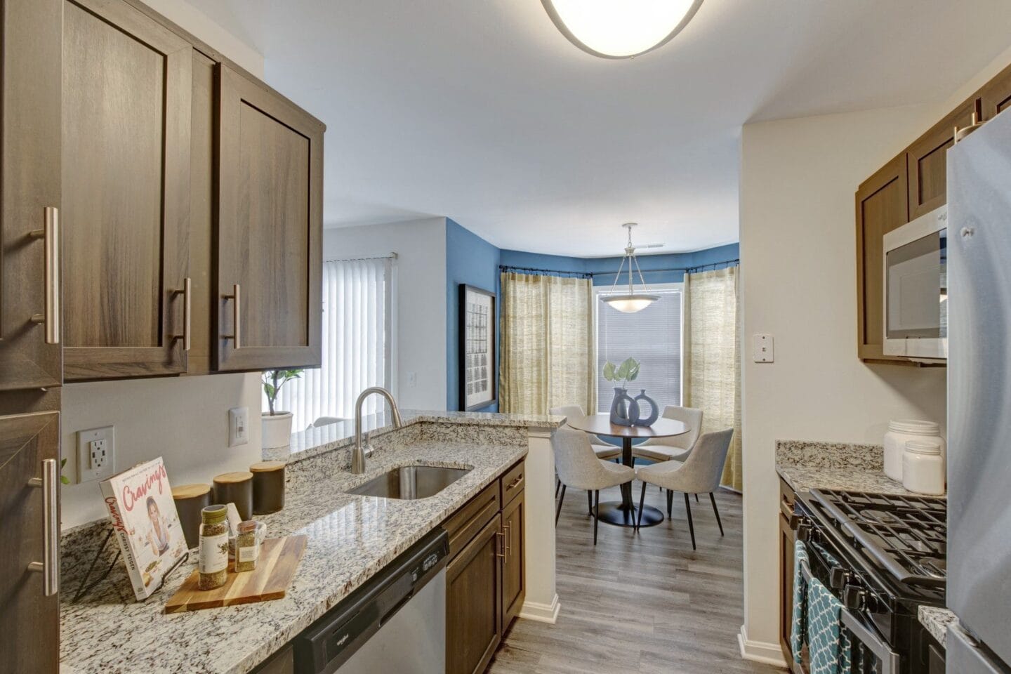 Kitchen with granite countertops and nearby dining room at Windsor Kingstowne, Alexandria, Virginia