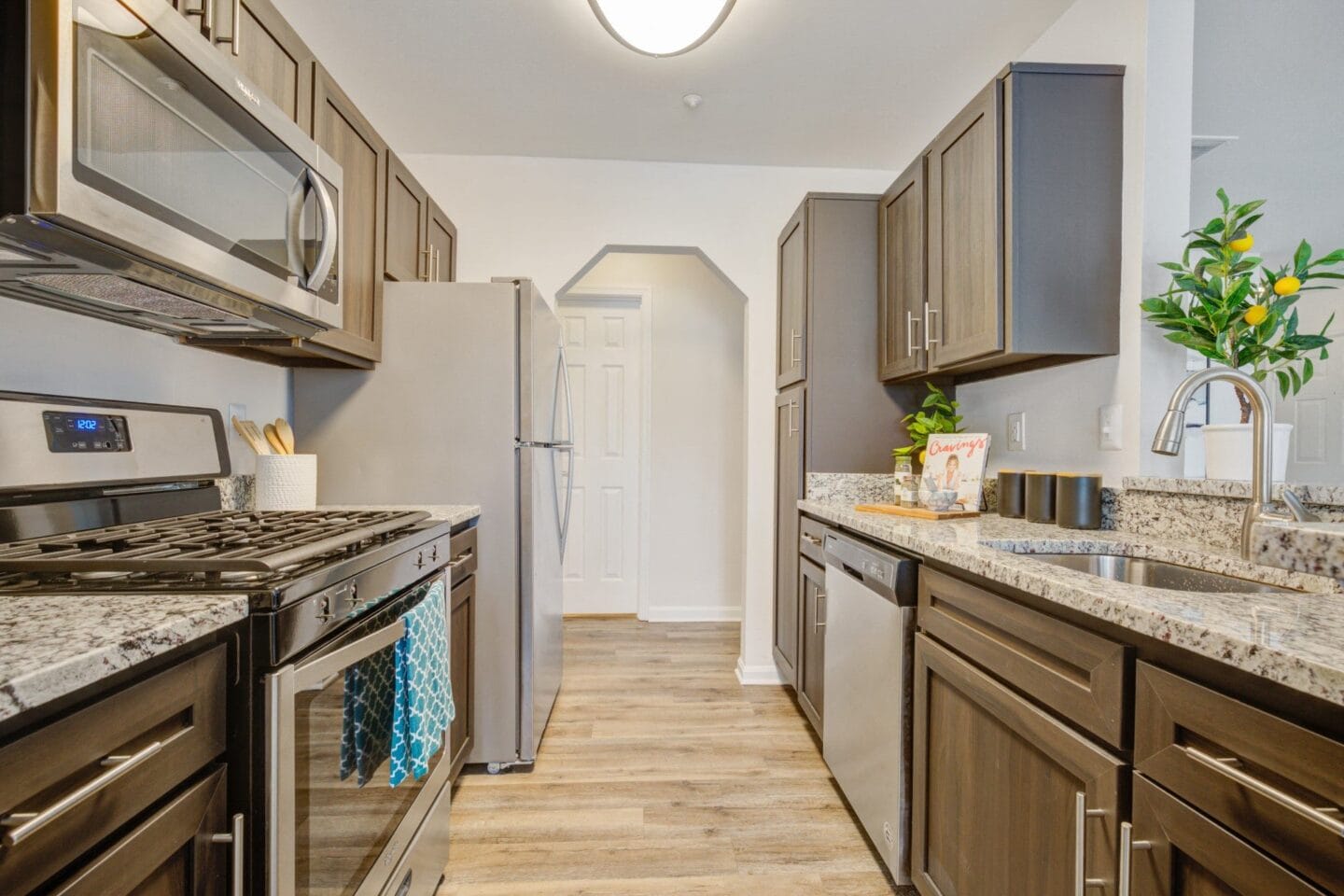 Kitchen with stainless steel appliances and granite countertops at Windsor Kingstowne, Alexandria, Virginia 22315