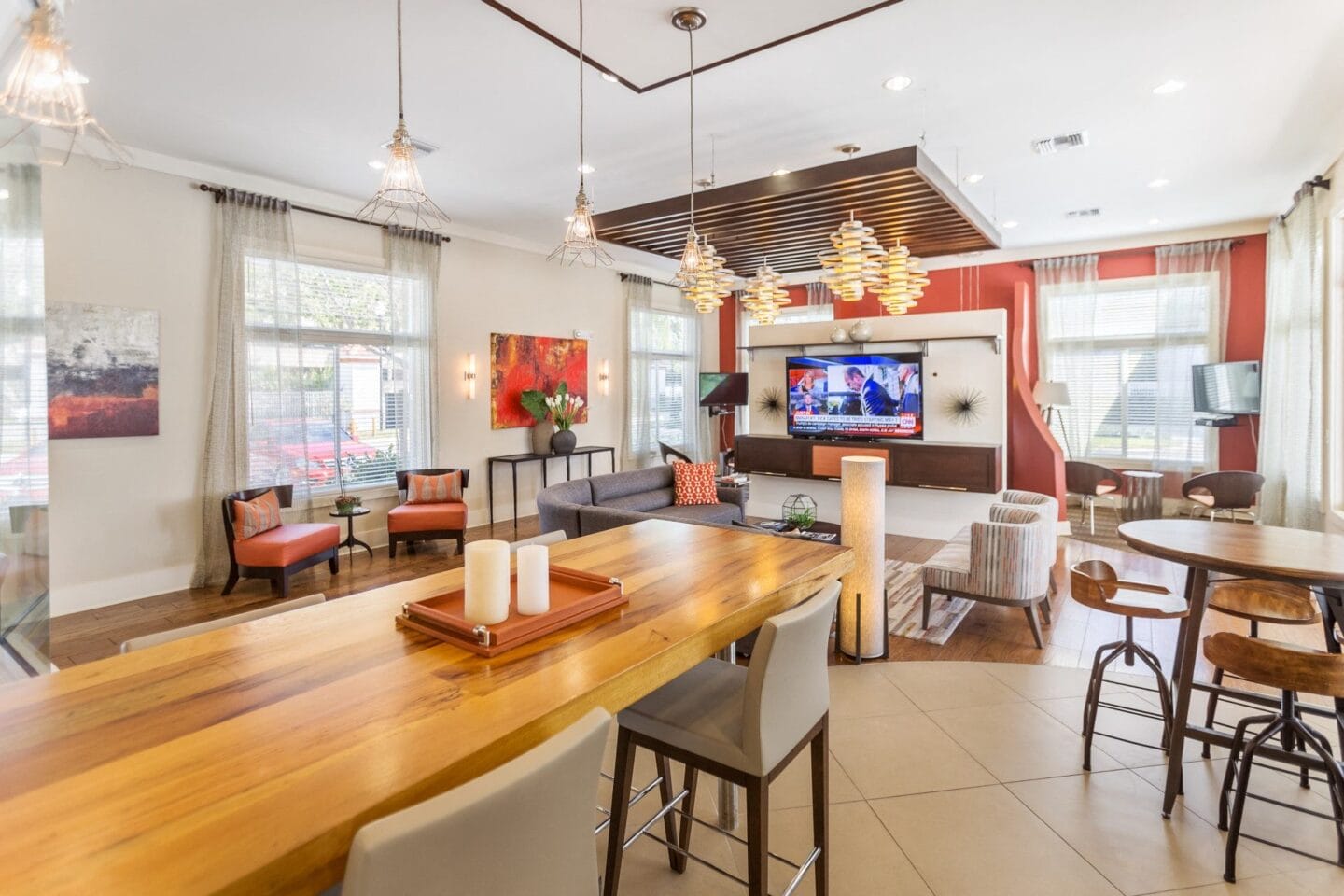 Community Clubhouse with Seating Area at Windsor Biscayne Shores in North Miaming room filled with furniture and a flat screen tv