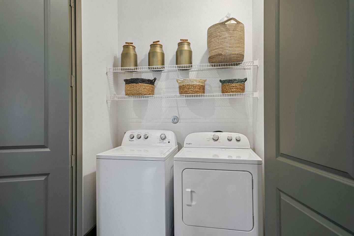 Washer and dryer in laundry room at The Lakeyard District