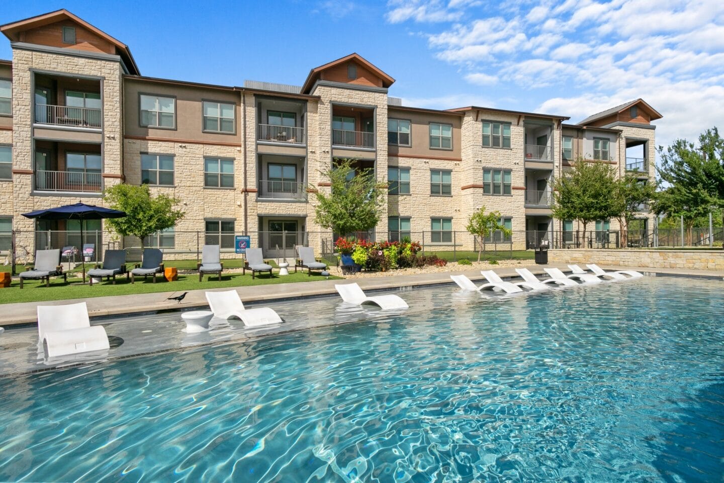 Swimming pool with chairs at The Lakeyard District