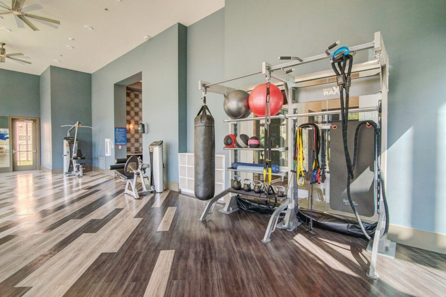 Fitness center with weights and other equipment at Windsor Lakeyard District in the Colony TX