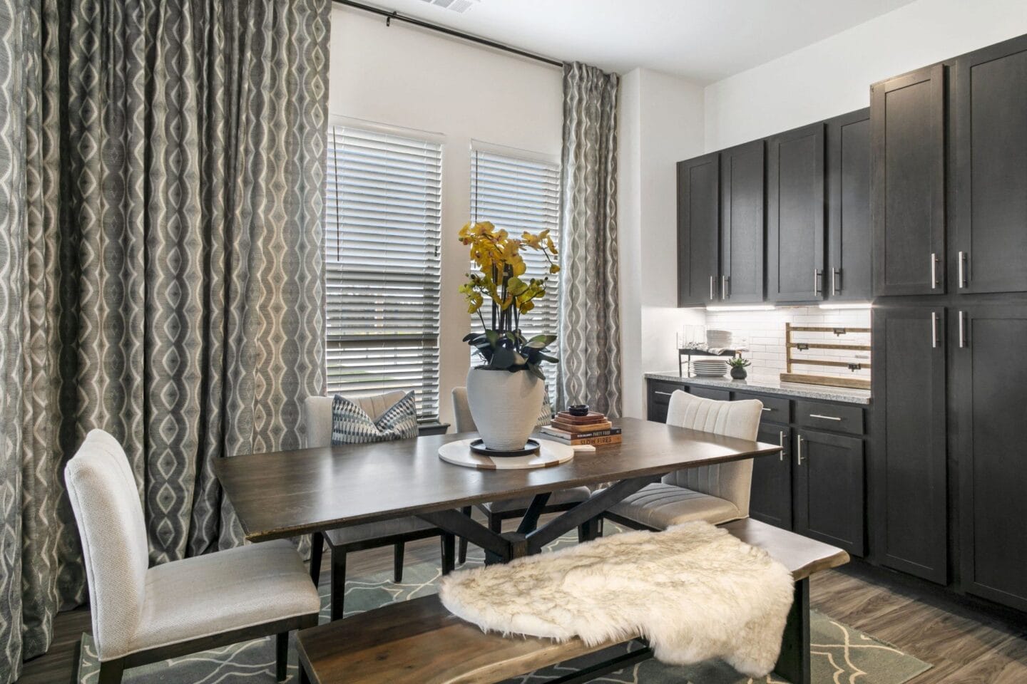 Dining area with a table and chairs at Windsor Lakeyard District, an apartment community in North Dallas