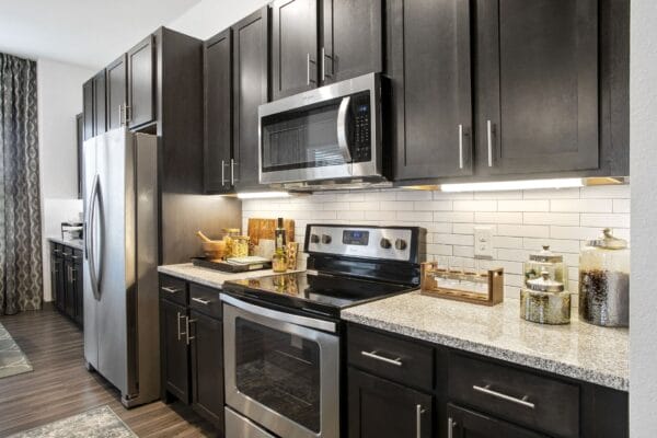 Kitchen with Granite Countertops at Windsor Lakeyard District in the Colony TX