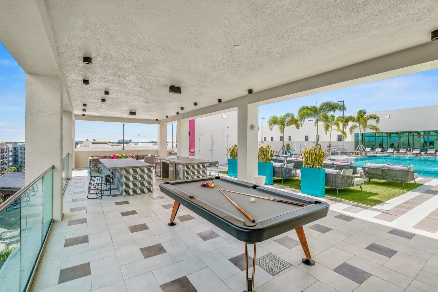 Pool table and outdoor lounge at Windsor Ludlam Trail in Miami, FL.