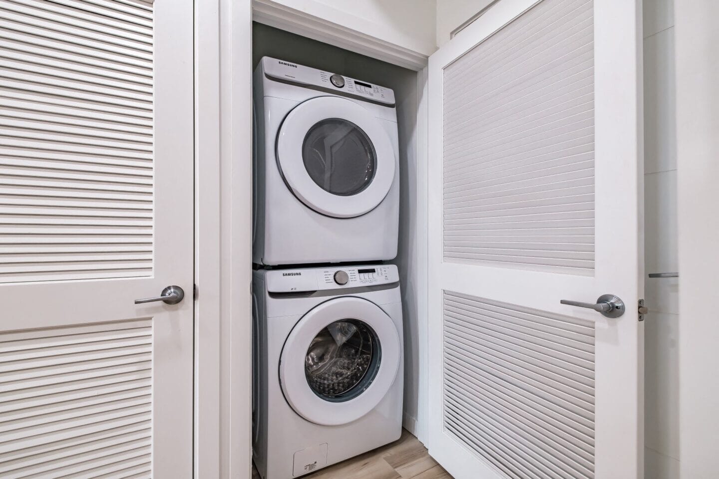 Washer and dryer in a laundry room at Windsor Ludlam Trail in Miami, FL.