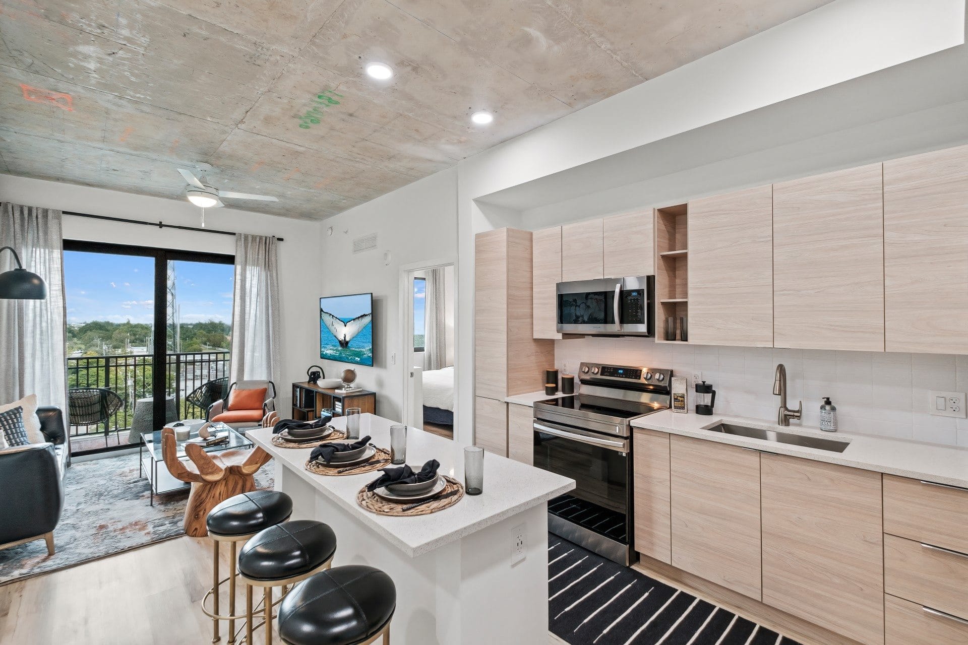 Kitchen with wooden cabinets and a white counter top at Windsor Ludlam Trail in Miami, FL.