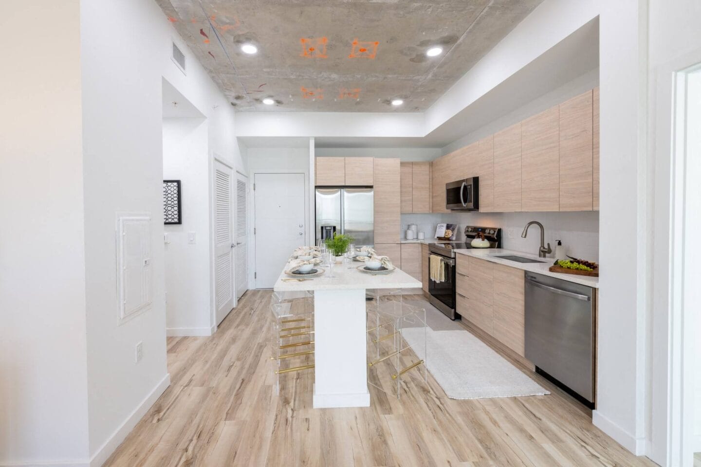 Kitchen with wood floors and white walls at Windsor Ludlam Trail in Miami, FL.