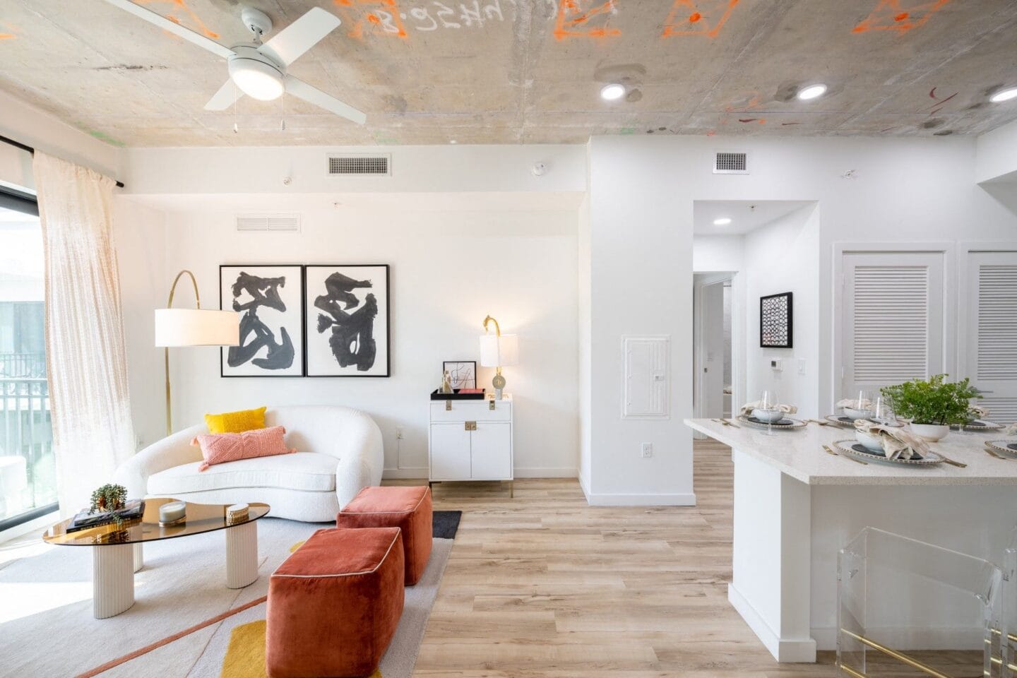 Living room with white walls and hardwood floors