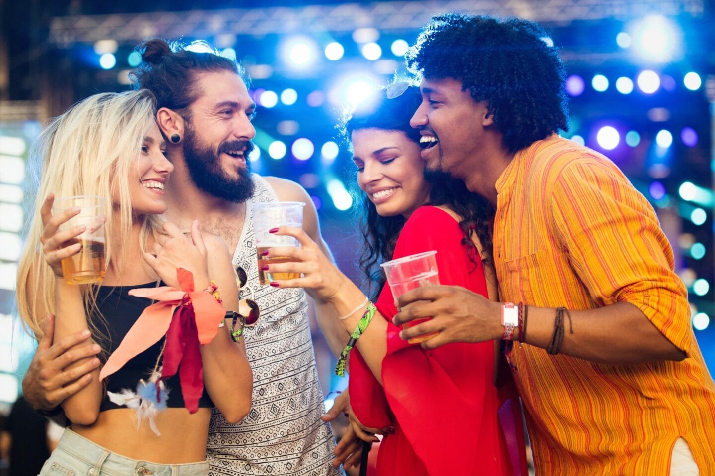 Group of friends drinking beer at a night club near Windsor Ludlam Trail in Miami, FL.