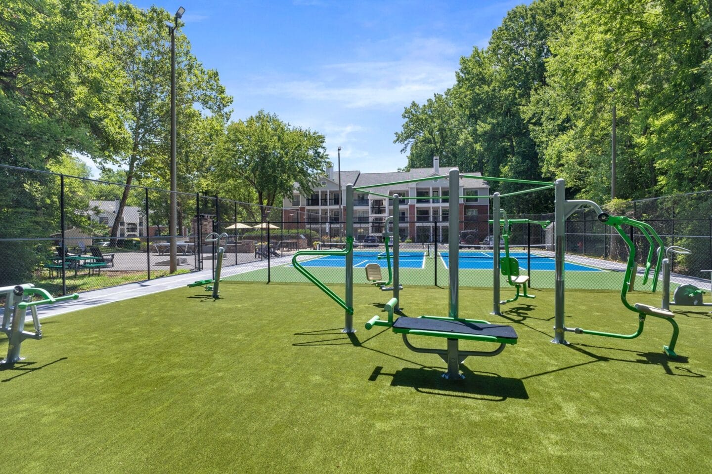 a park with swings and a swimming pool