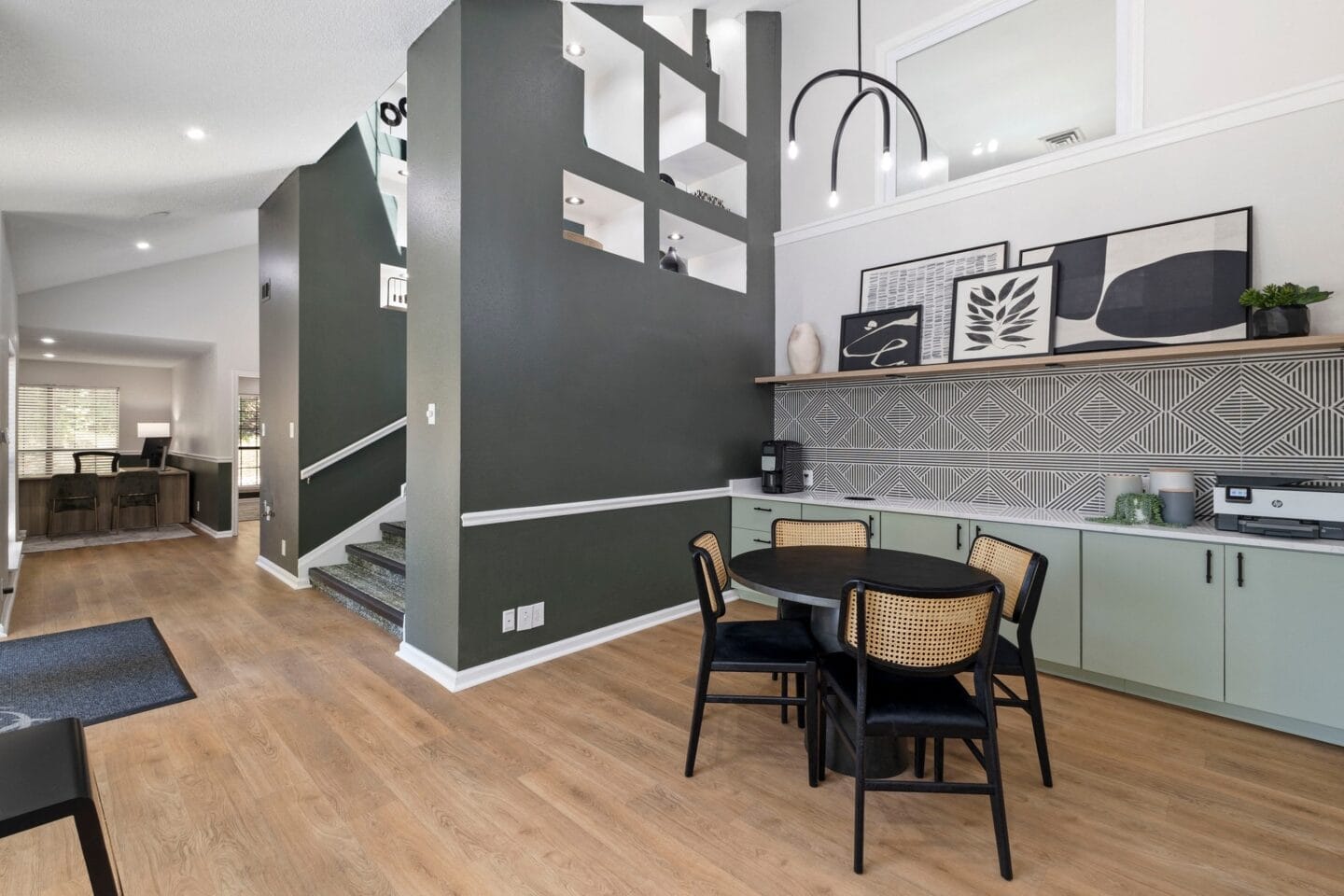 a dining room and living room with a table and chairs